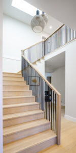Wood stairs, white interior paint, Interior renovations by Square One Construction